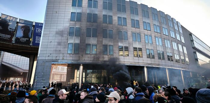 Crowd gathered near smoke outside a Brussels building