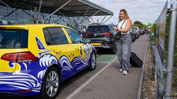 Passenger being dropped off outside Edinburgh Airport