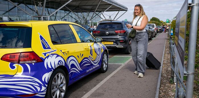 Passenger being dropped off outside Edinburgh Airport