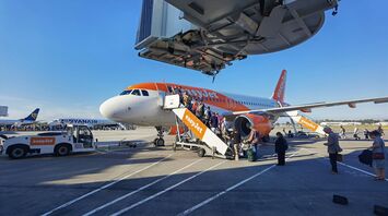 Passengers boarding an easyJet aircraft