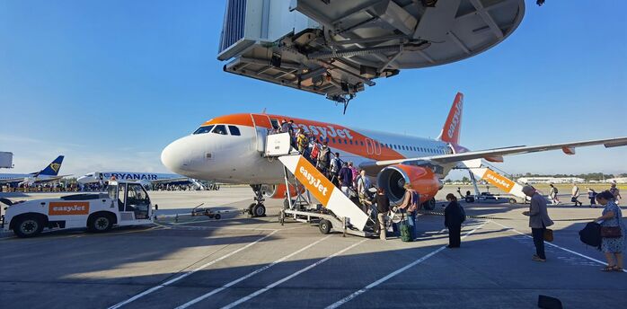 Passengers boarding an easyJet aircraft