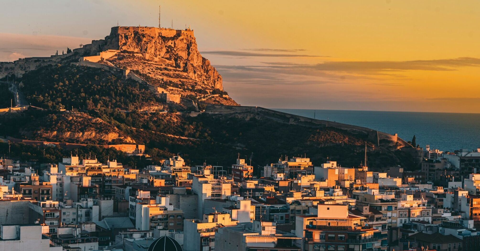 Alicante skyline and castle at sunset