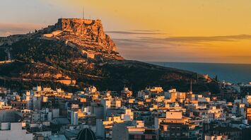 Alicante skyline and castle at sunset