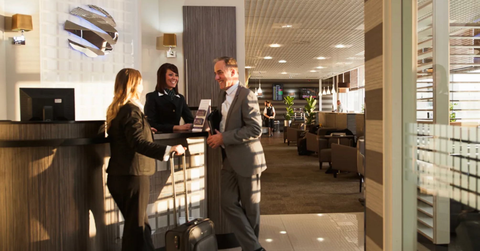 Passengers checking in at an airport lounge