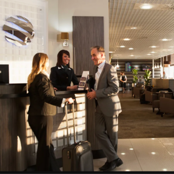 Passengers checking in at an airport lounge