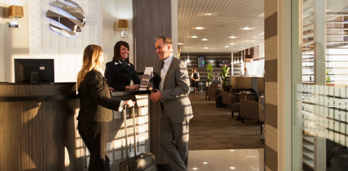 Passengers checking in at an airport lounge