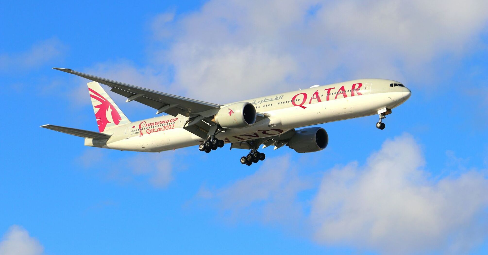 Qatar Airways aircraft flying through the sky