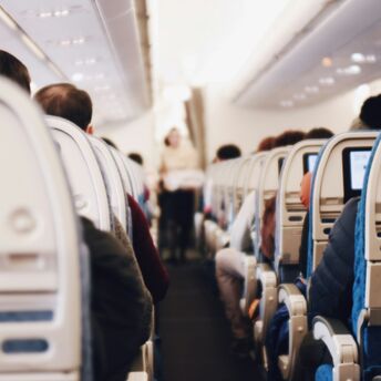 Passengers seated inside an aircraft cabin
