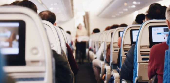 Passengers seated inside an aircraft cabin
