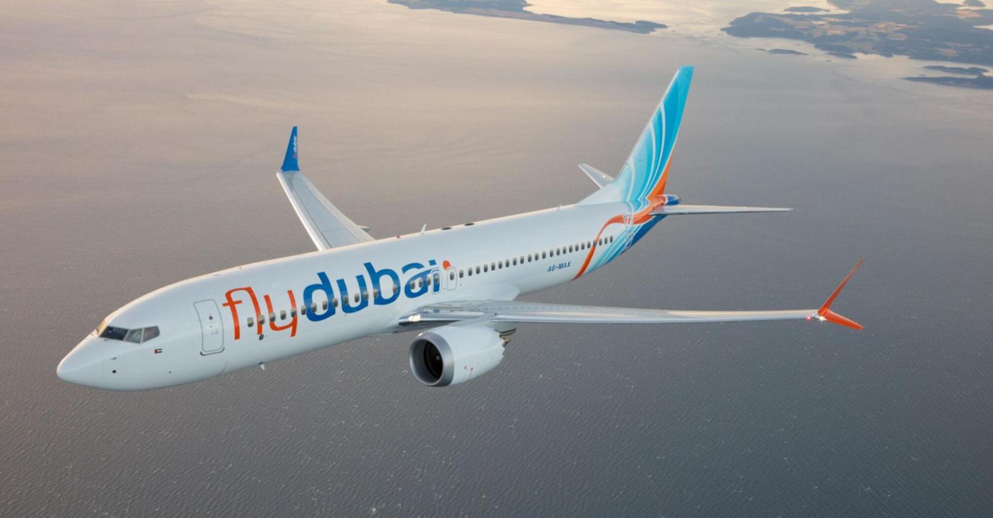 flydubai aircraft flying over coastal waters