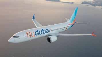 flydubai aircraft flying over coastal waters