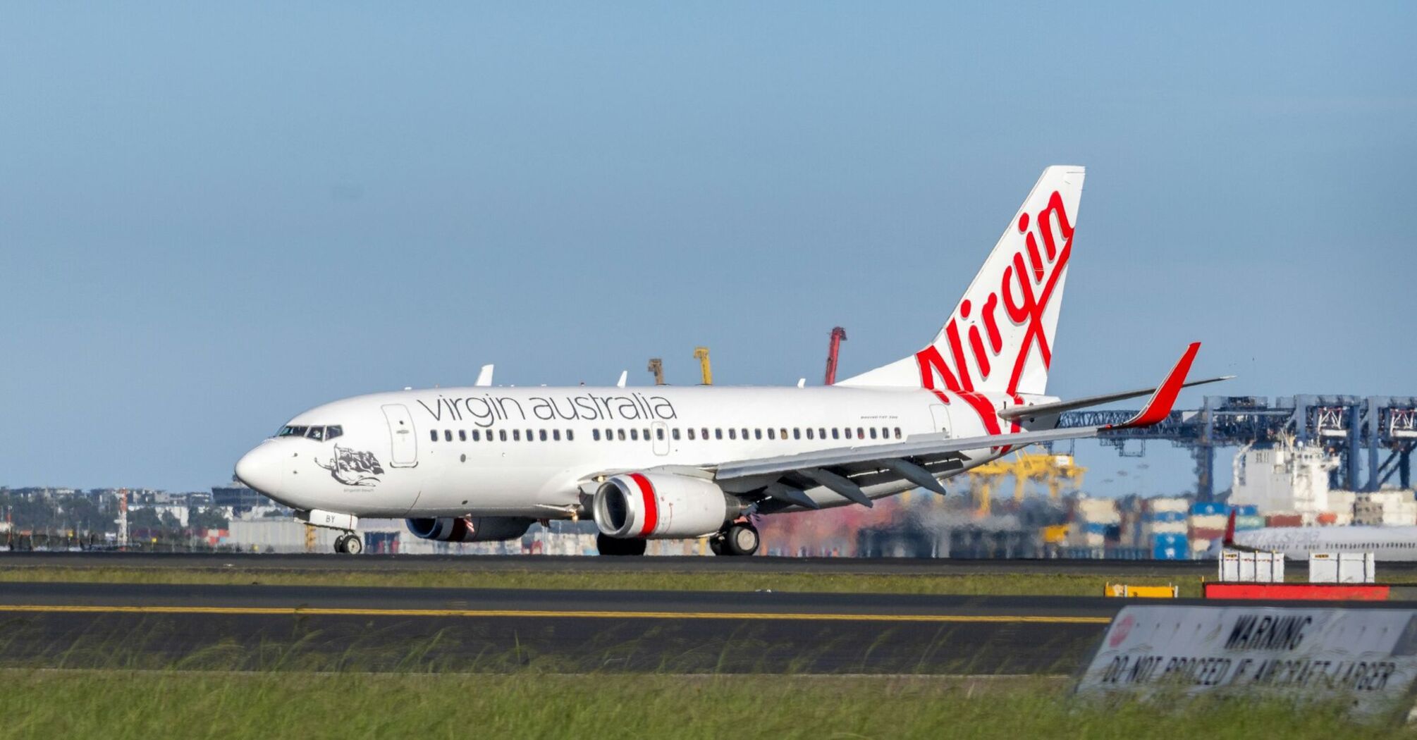Virgin Australia aircraft on the runway at an airport