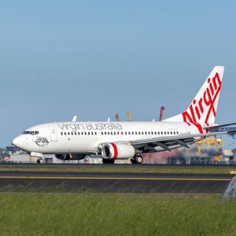 Virgin Australia aircraft on the runway at an airport