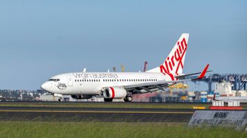 Virgin Australia aircraft on the runway at an airport