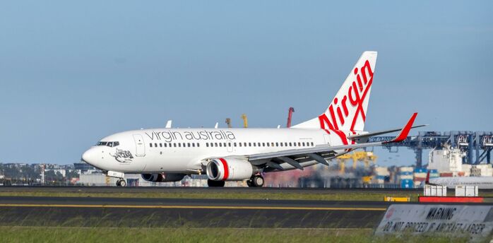 Virgin Australia aircraft on the runway at an airport