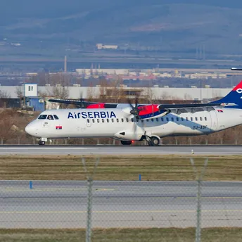 Air Serbia aircraft taxiing on runway at airport
