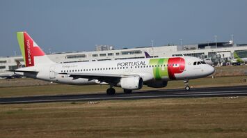 TAP Air Portugal aircraft taxiing at an airport runway