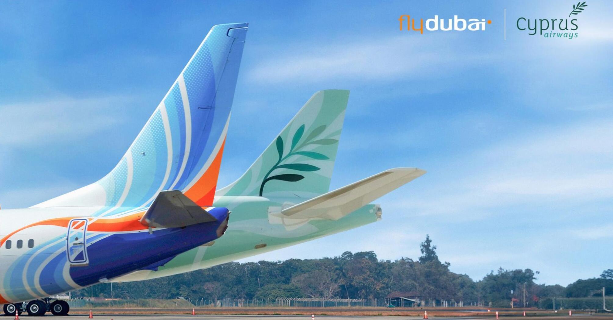 flydubai and Cyprus Airways aircraft tails on a runway