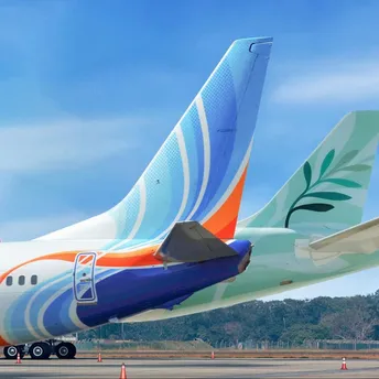 flydubai and Cyprus Airways aircraft tails on a runway