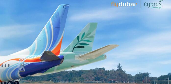 flydubai and Cyprus Airways aircraft tails on a runway