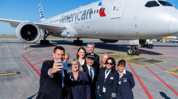American Airlines crew taking a selfie beside a Boeing aircraft