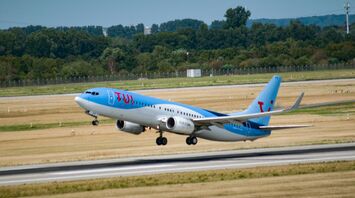 TUI aircraft taking off from an airport runway