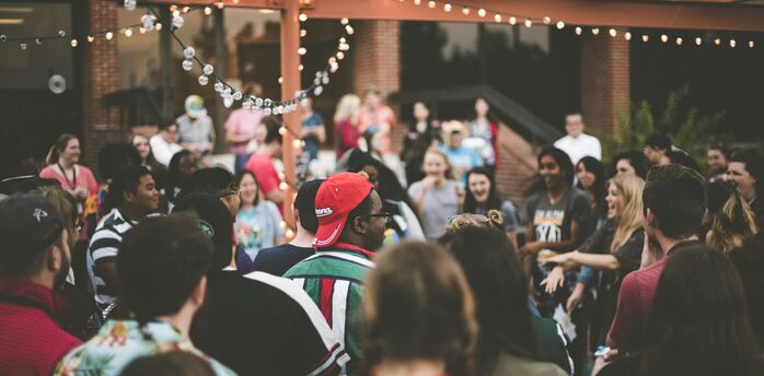 Crowd gathered at an outdoor summer event