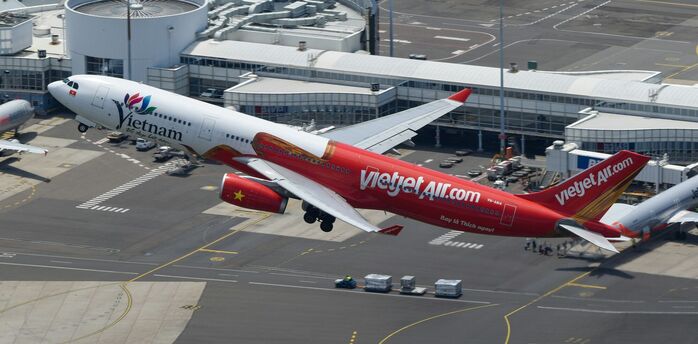 Vietjet aircraft taking off at an airport