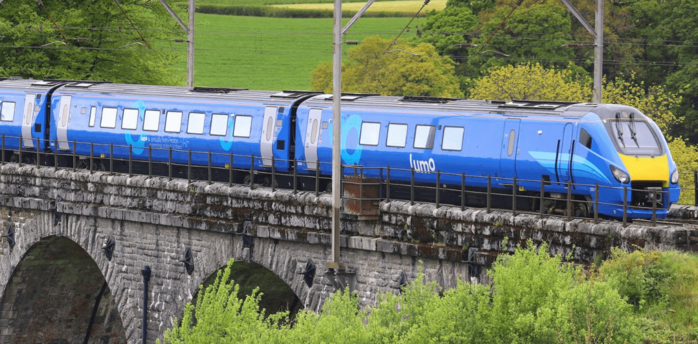 Lumo train crossing a stone railway viaduct