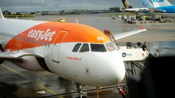 easyJet aircraft parked at an airport gate
