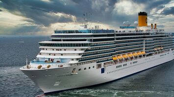 Costa cruise ship sailing at sea under a cloudy sky