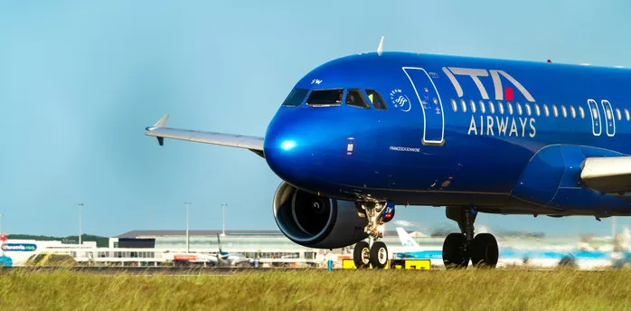ITA Airways aircraft on runway at airport