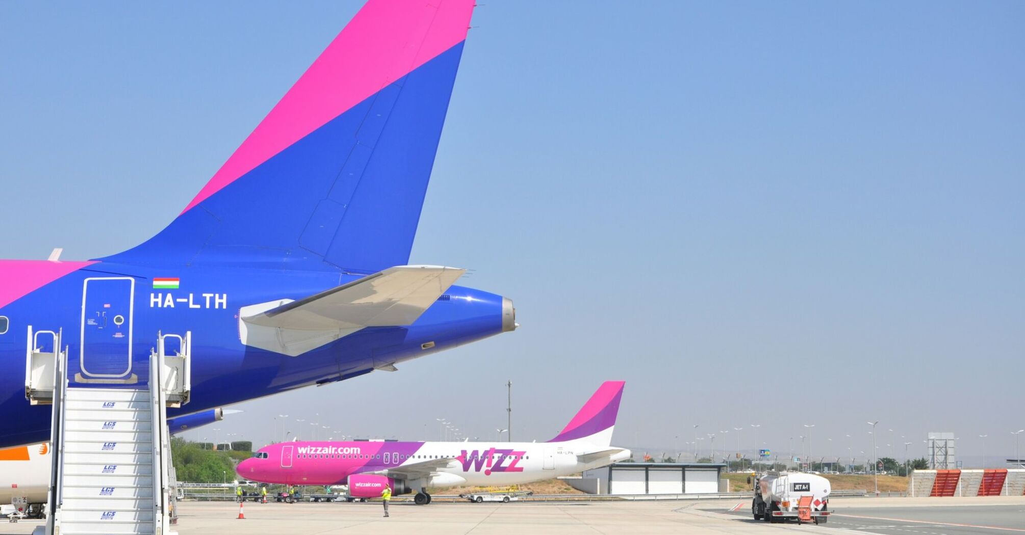 Wizz Air aircraft parked on an airport apron