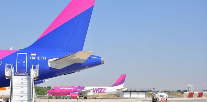 Wizz Air aircraft parked on an airport apron
