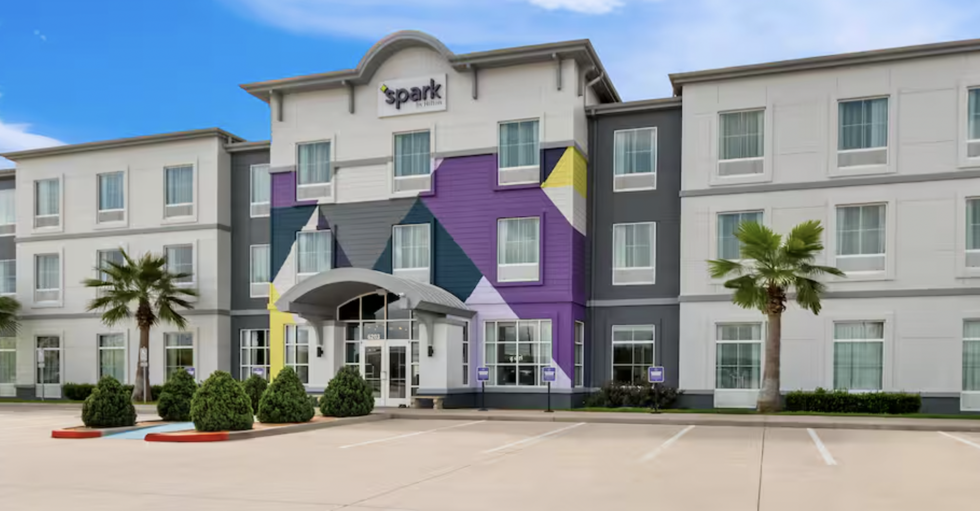 Exterior of a Spark by Hilton hotel building