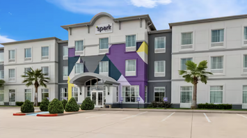 Exterior of a Spark by Hilton hotel building