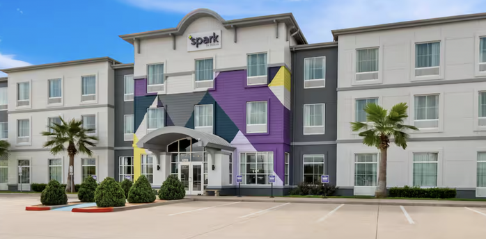 Exterior of a Spark by Hilton hotel building