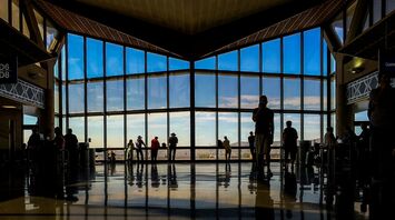 Passengers inside an airport terminal