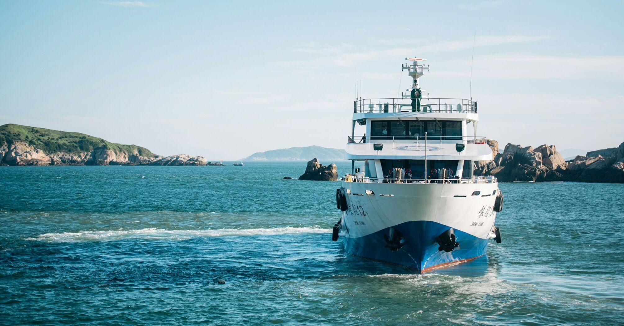 Ferry sailing across open blue water