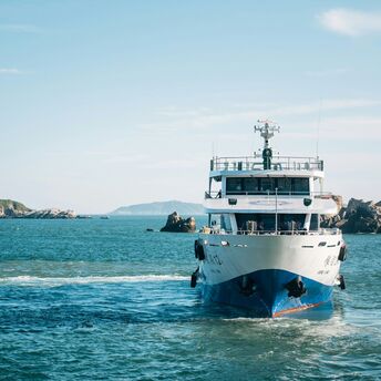 Ferry sailing across open blue water