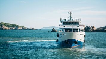 Ferry sailing across open blue water