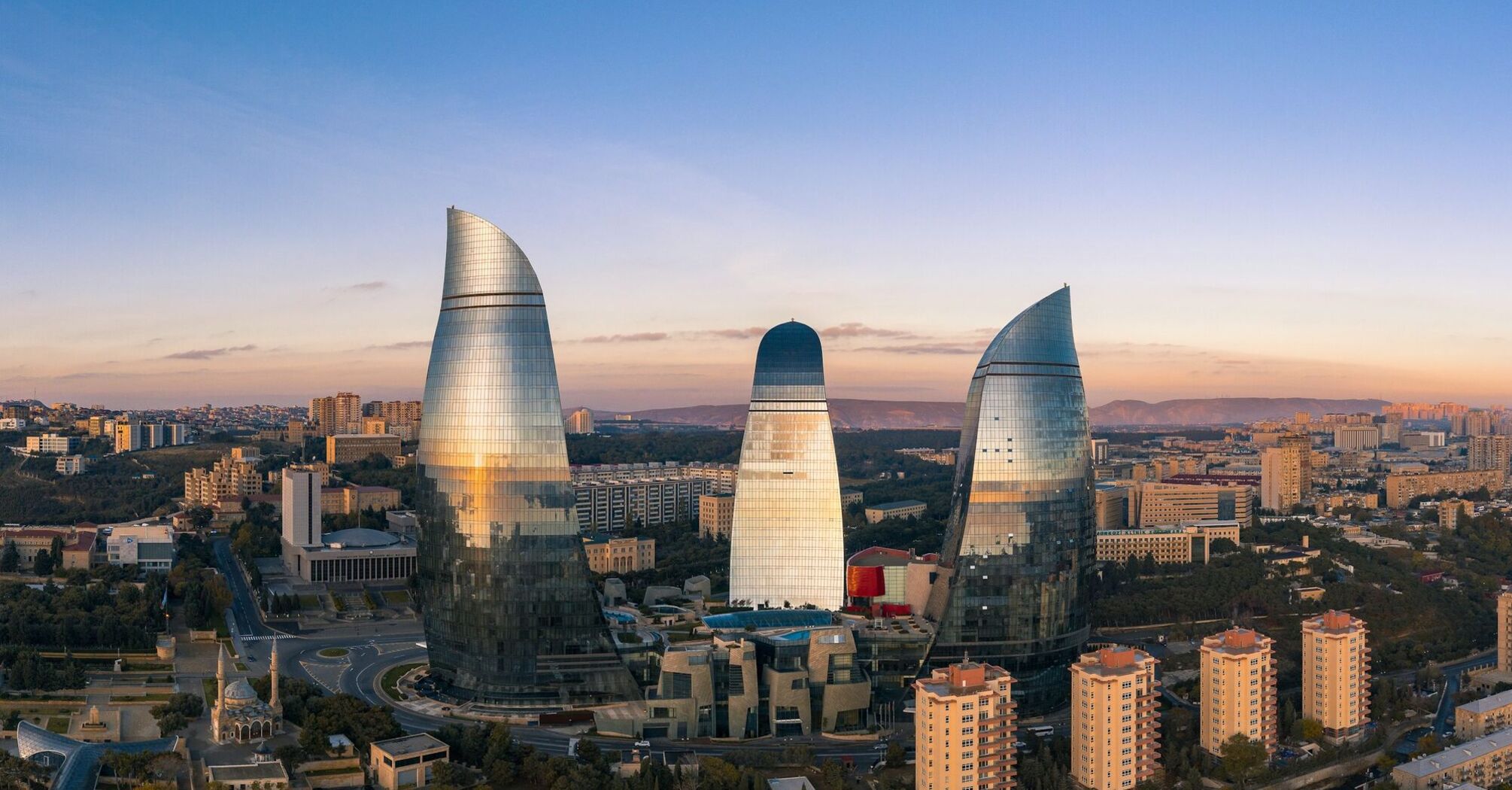 Flame Towers rising above Baku city at sunset