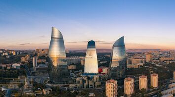 Flame Towers rising above Baku city at sunset