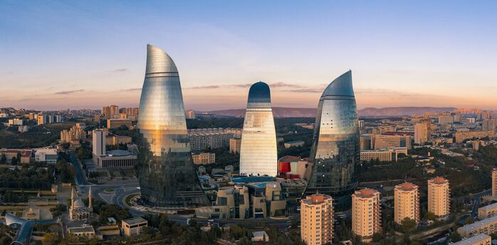 Flame Towers rising above Baku city at sunset