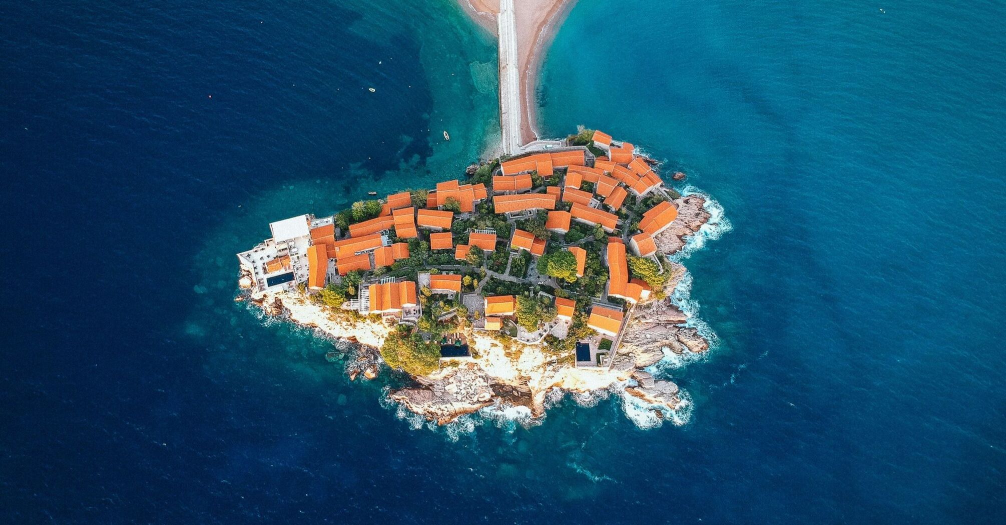 Aerial view of Sveti Stefan island resort connected to Montenegro’s mainland