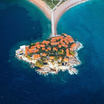 Aerial view of Sveti Stefan island resort connected to Montenegro’s mainland