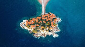 Aerial view of Sveti Stefan island resort connected to Montenegro’s mainland