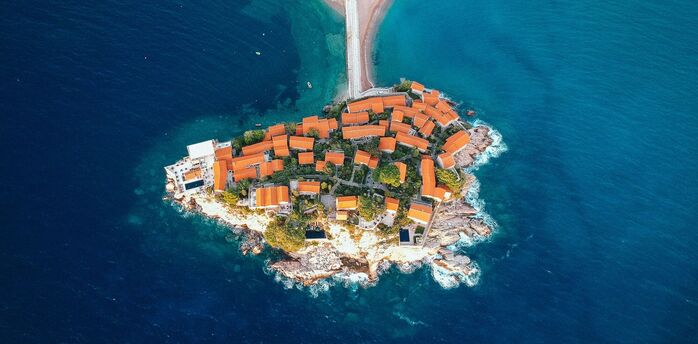 Aerial view of Sveti Stefan island resort connected to Montenegro’s mainland