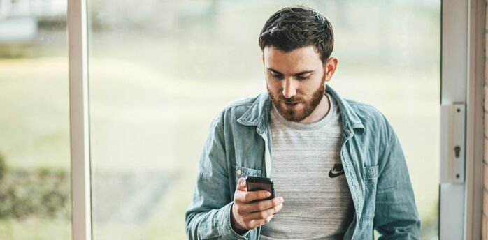 Man checking flight options on a smartphone
