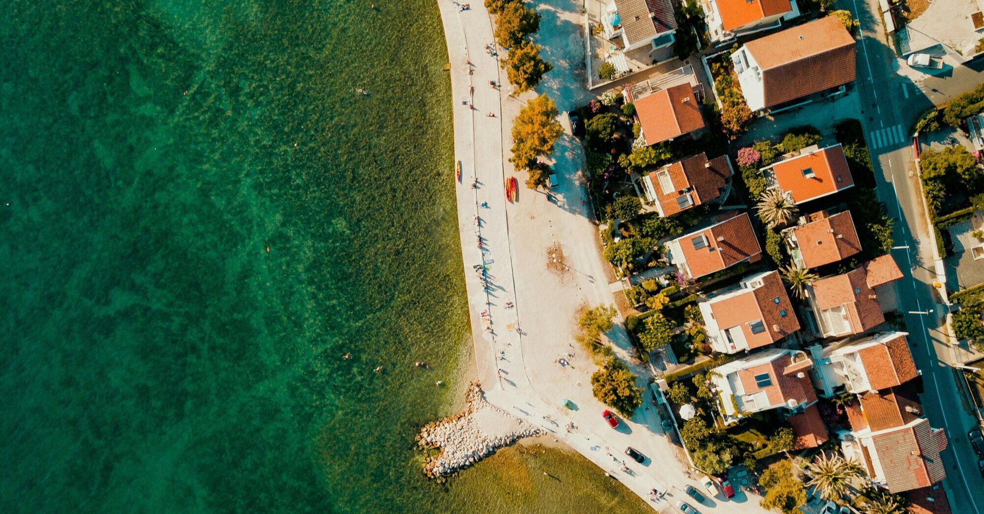 Aerial view of Zadar’s coastline with clear Adriatic water and seaside homes